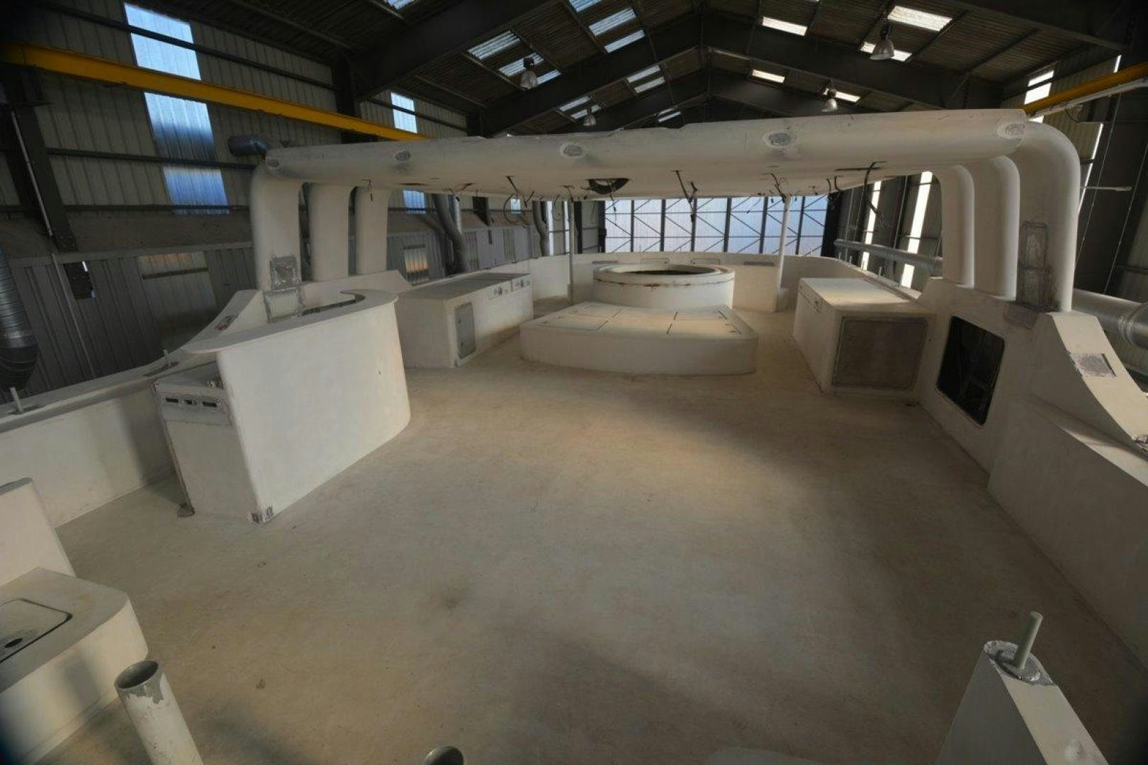 a room with tables and chairs aboard MAGELLAN Yacht for Sale