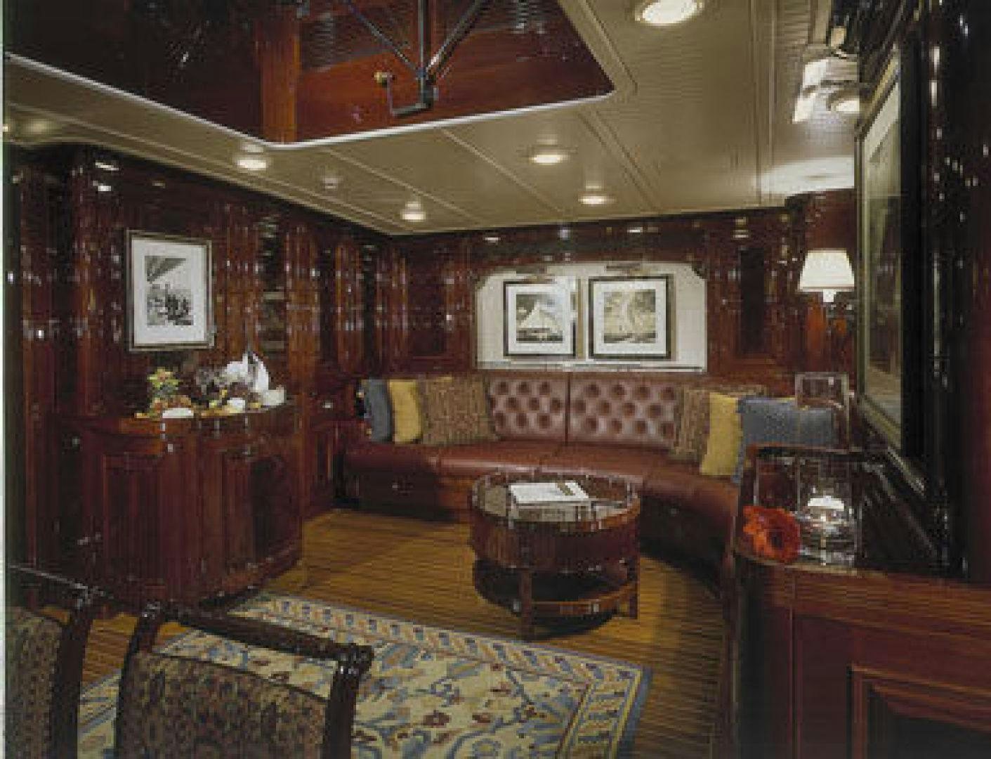 a living room with a couch and a table aboard RANGER Yacht for Sale