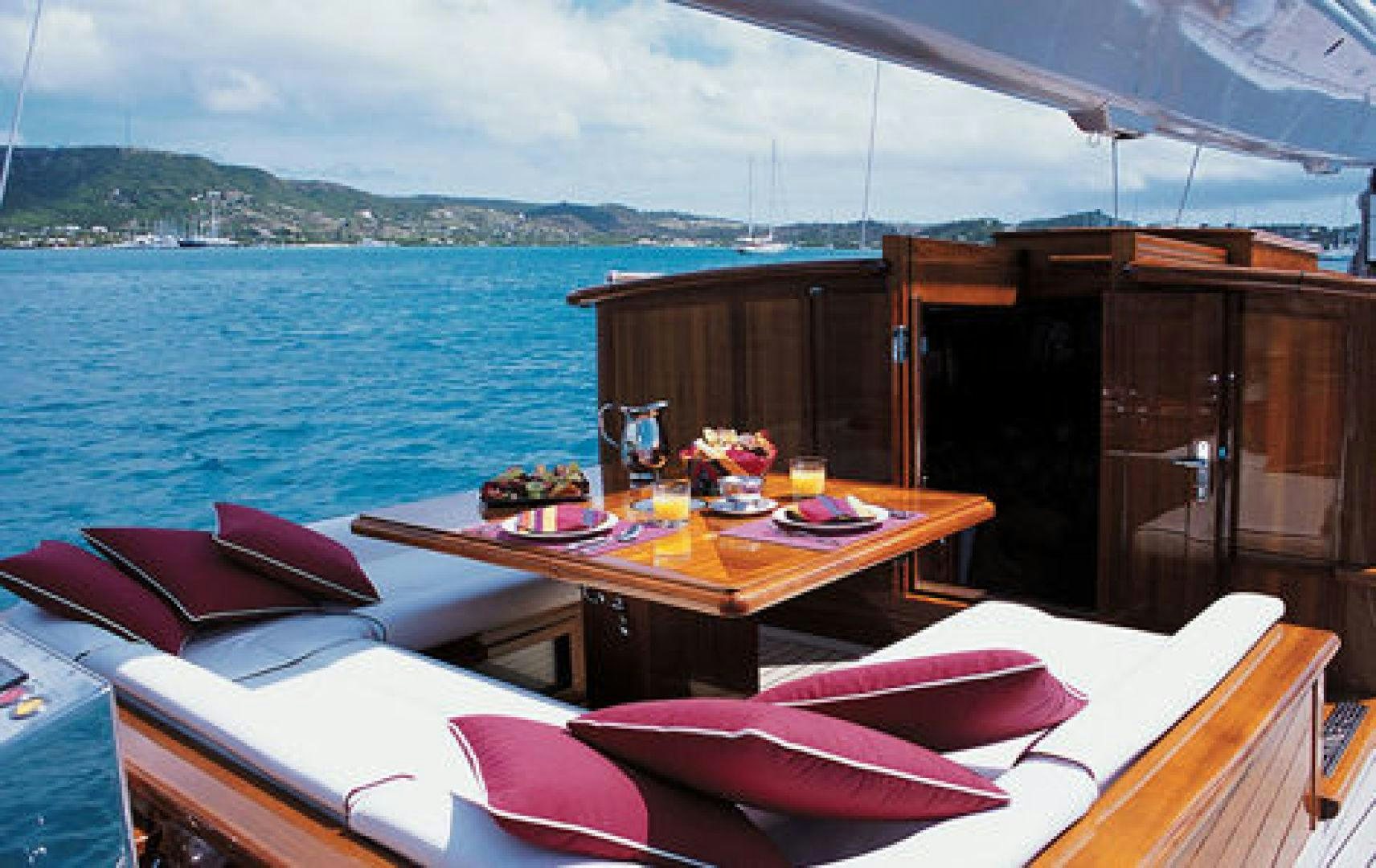 a boat with a table and chairs on the deck aboard RANGER Yacht for Sale