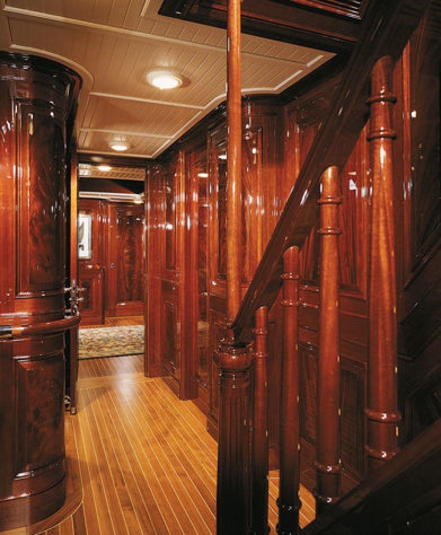 a wood hallway with wood railings aboard RANGER Yacht for Sale