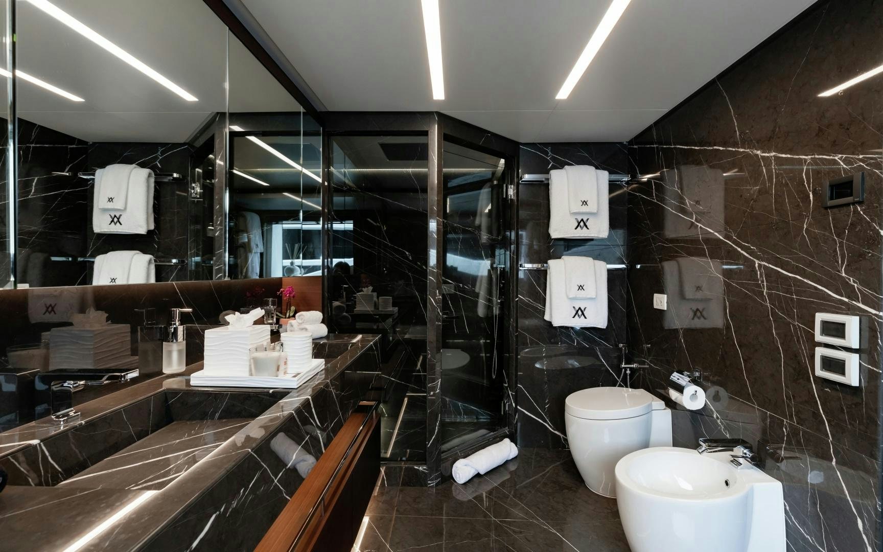 a bathroom with a glass shower aboard ALTAVITA Yacht for Sale