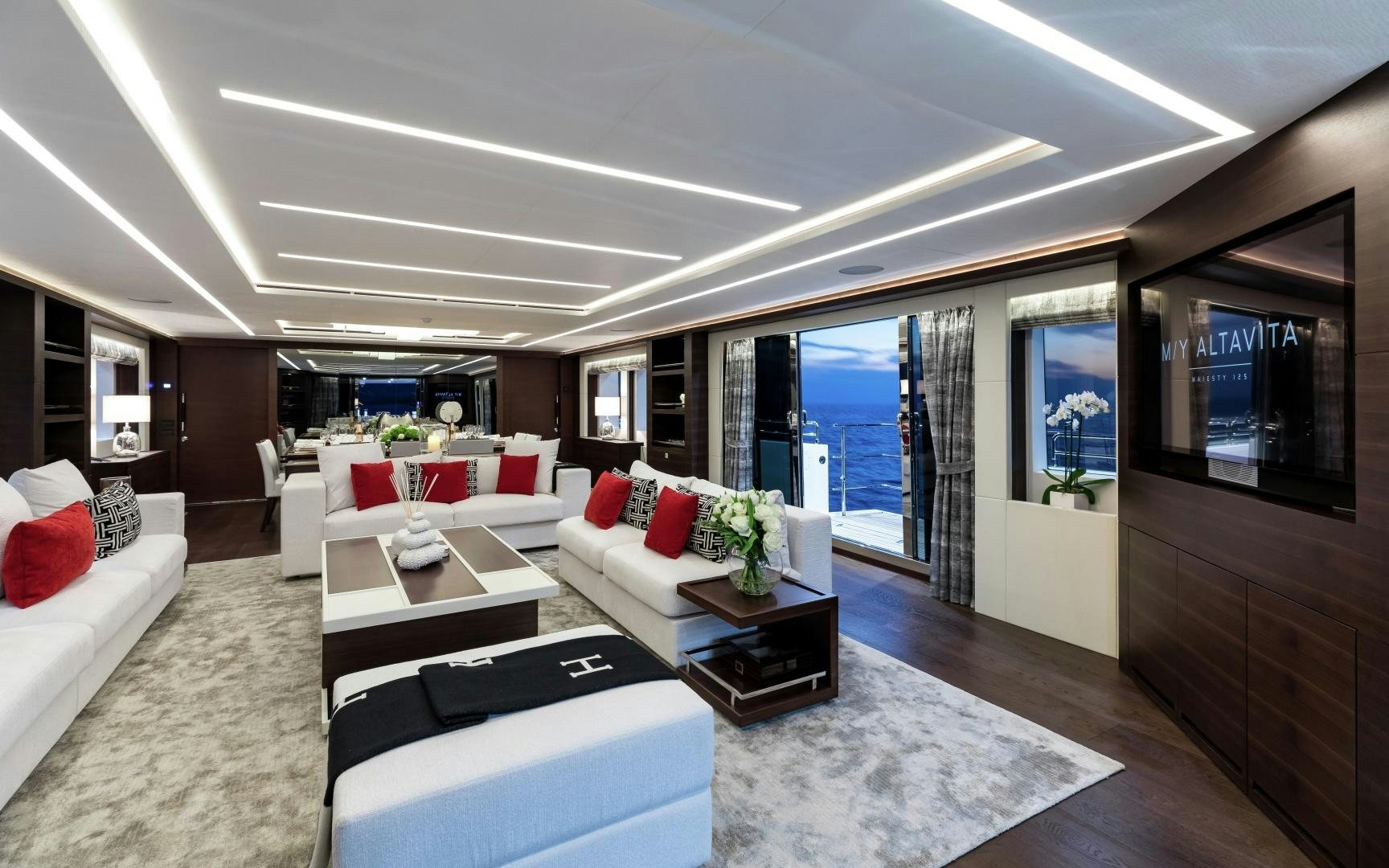 a living room with a large window aboard ALTAVITA Yacht for Sale