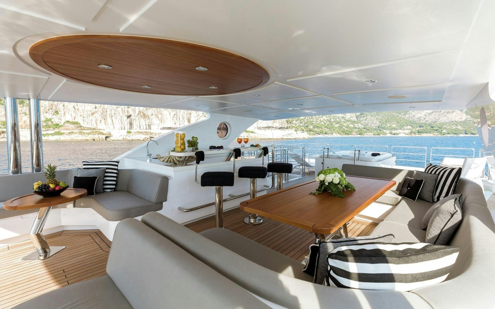 a large living room with a large table and chairs aboard ALTAVITA Yacht for Sale