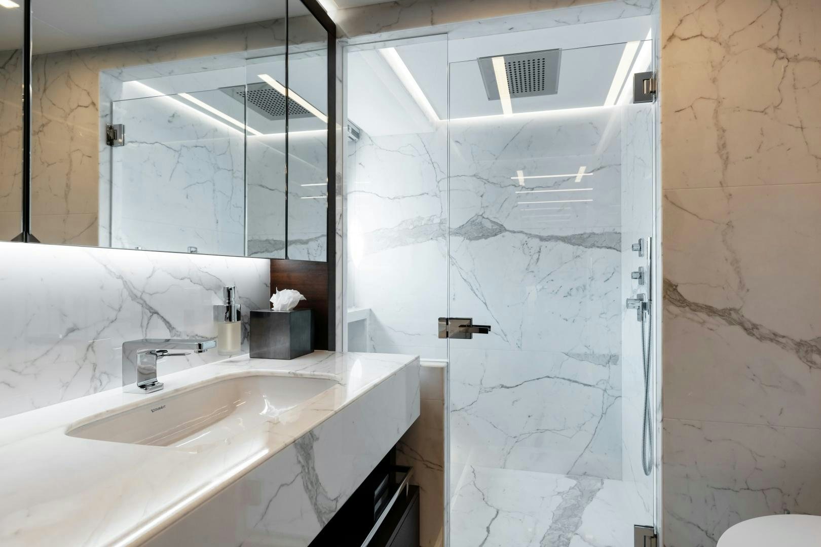a bathroom with a sink and a mirror aboard ALTAVITA Yacht for Sale