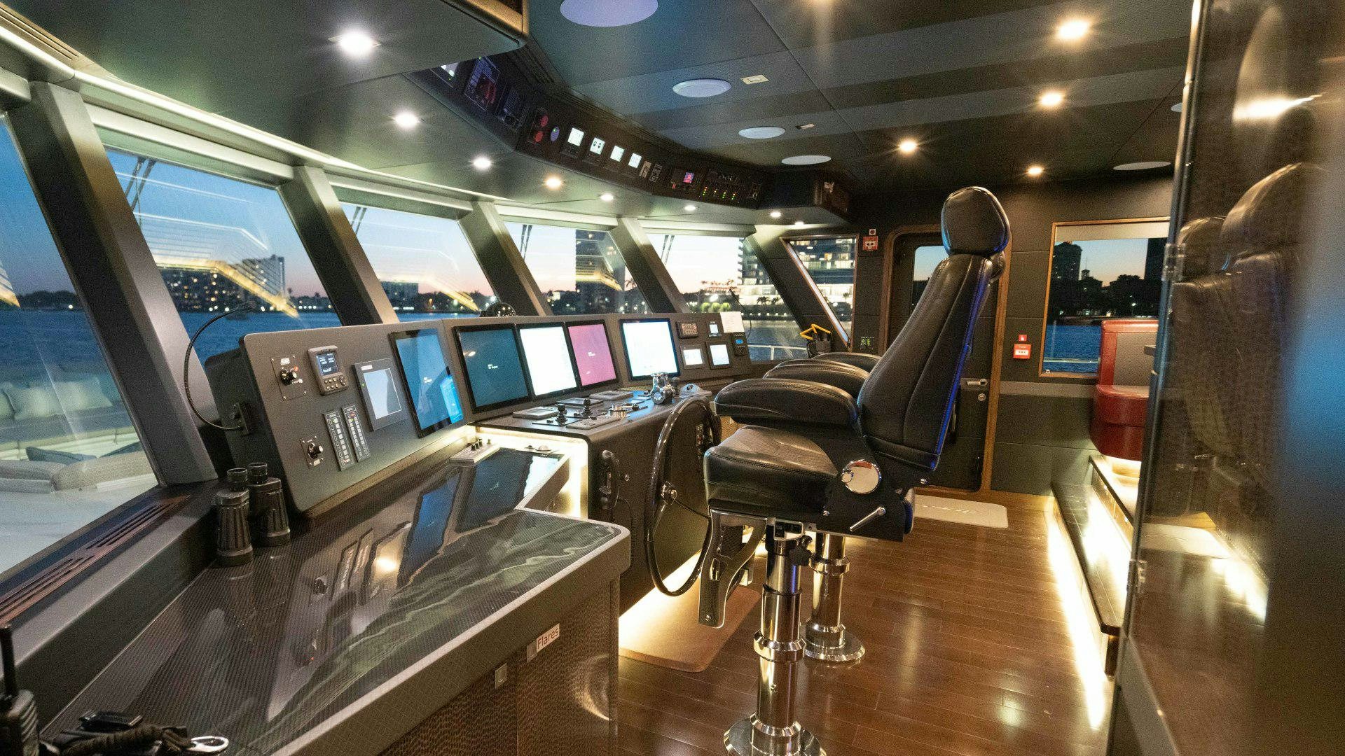 inside of a vehicle with many monitors aboard SERENITY Yacht for Sale