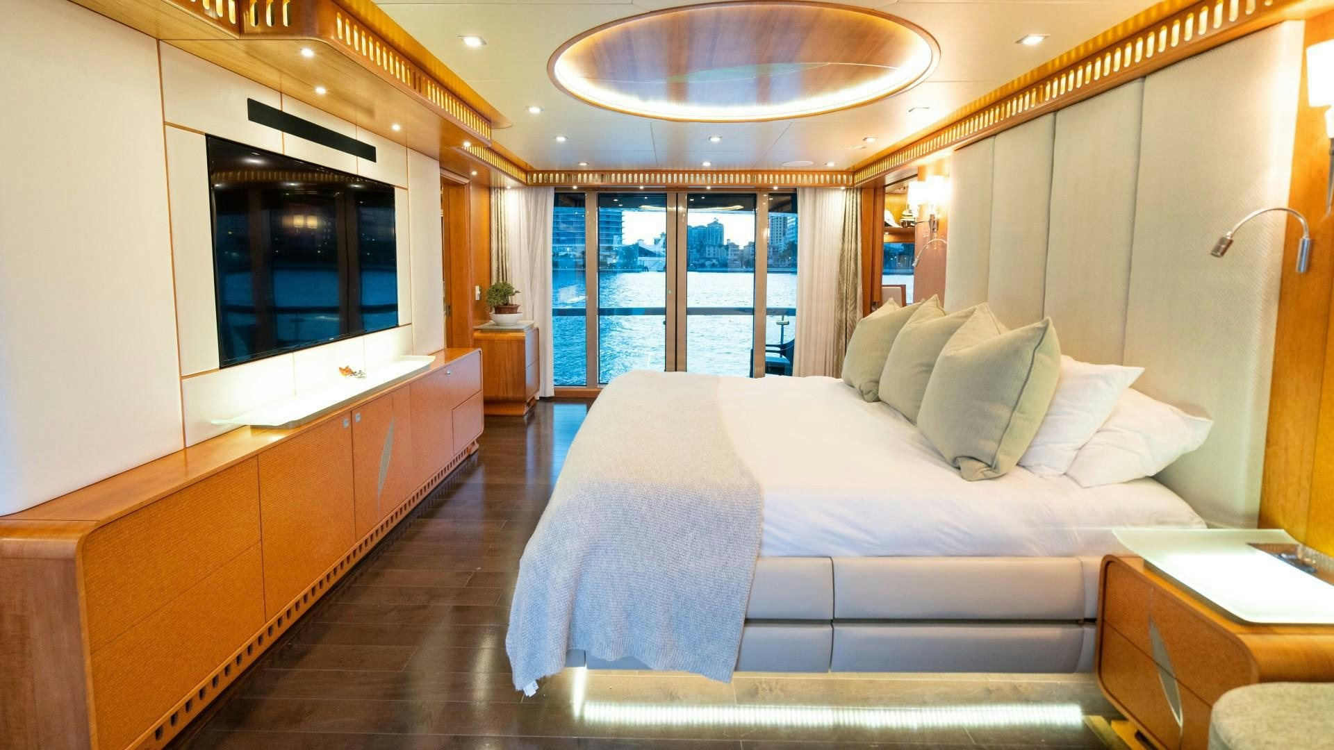 a large bedroom with a large bed aboard SERENITY Yacht for Sale