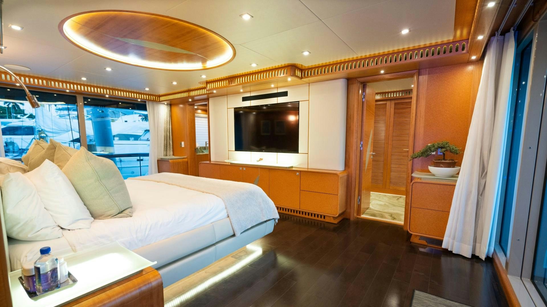 a room with a couch and a television aboard SERENITY Yacht for Sale
