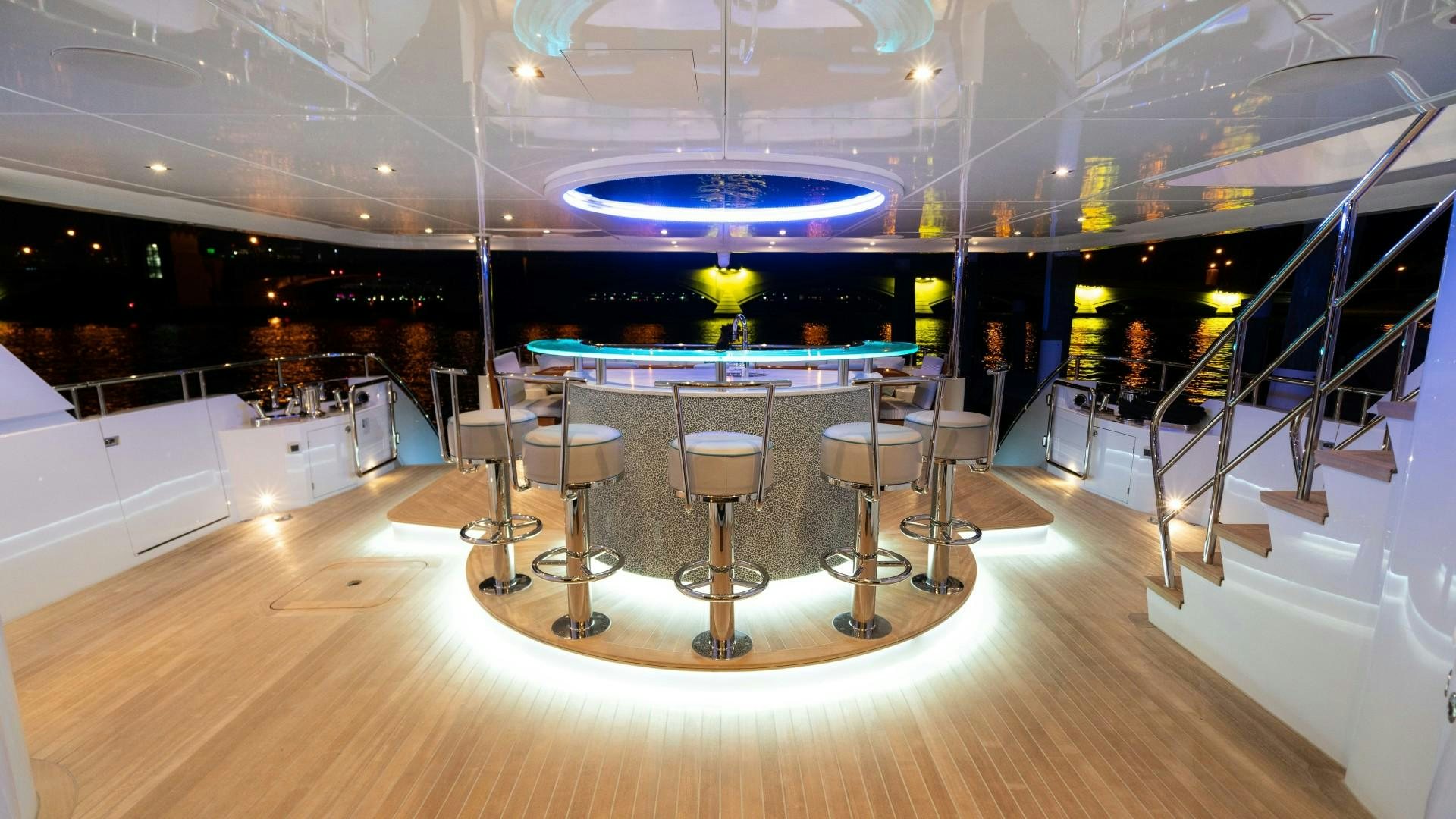 a room with tables and chairs aboard SERENITY Yacht for Sale