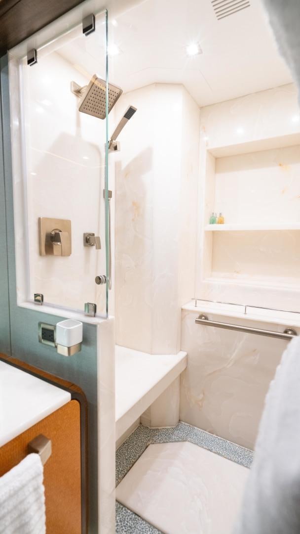 a bathroom with a shower and sink aboard SERENITY Yacht for Sale