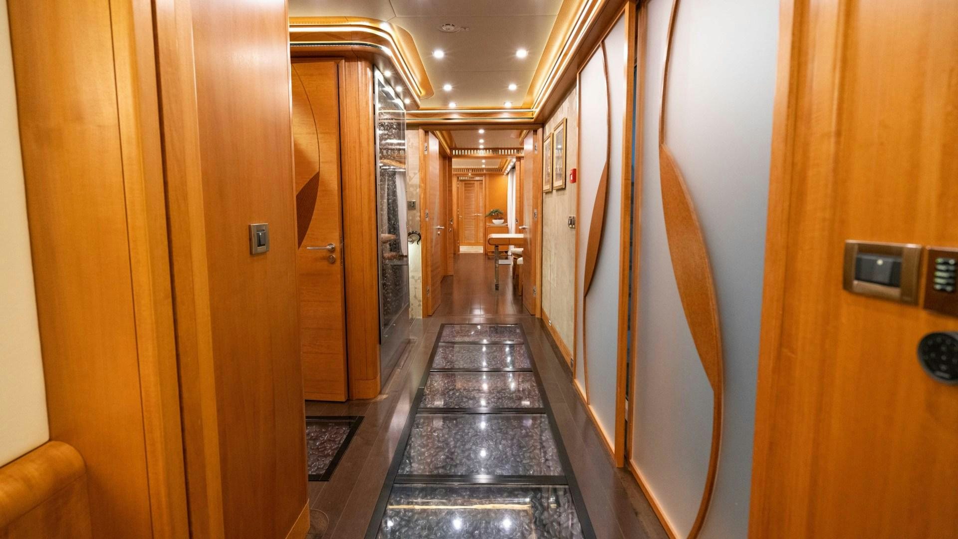 a hallway with doors aboard SERENITY Yacht for Sale