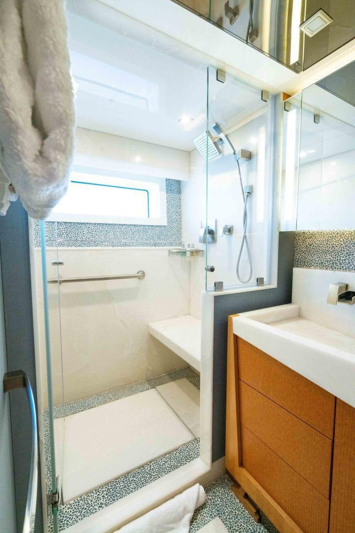 a bathroom with a sink and a shower aboard SERENITY Yacht for Sale