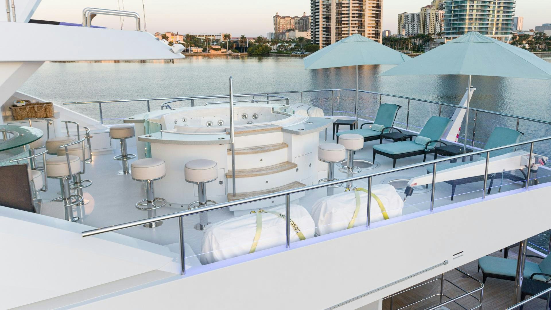 a boat with stools on the deck aboard SERENITY Yacht for Sale