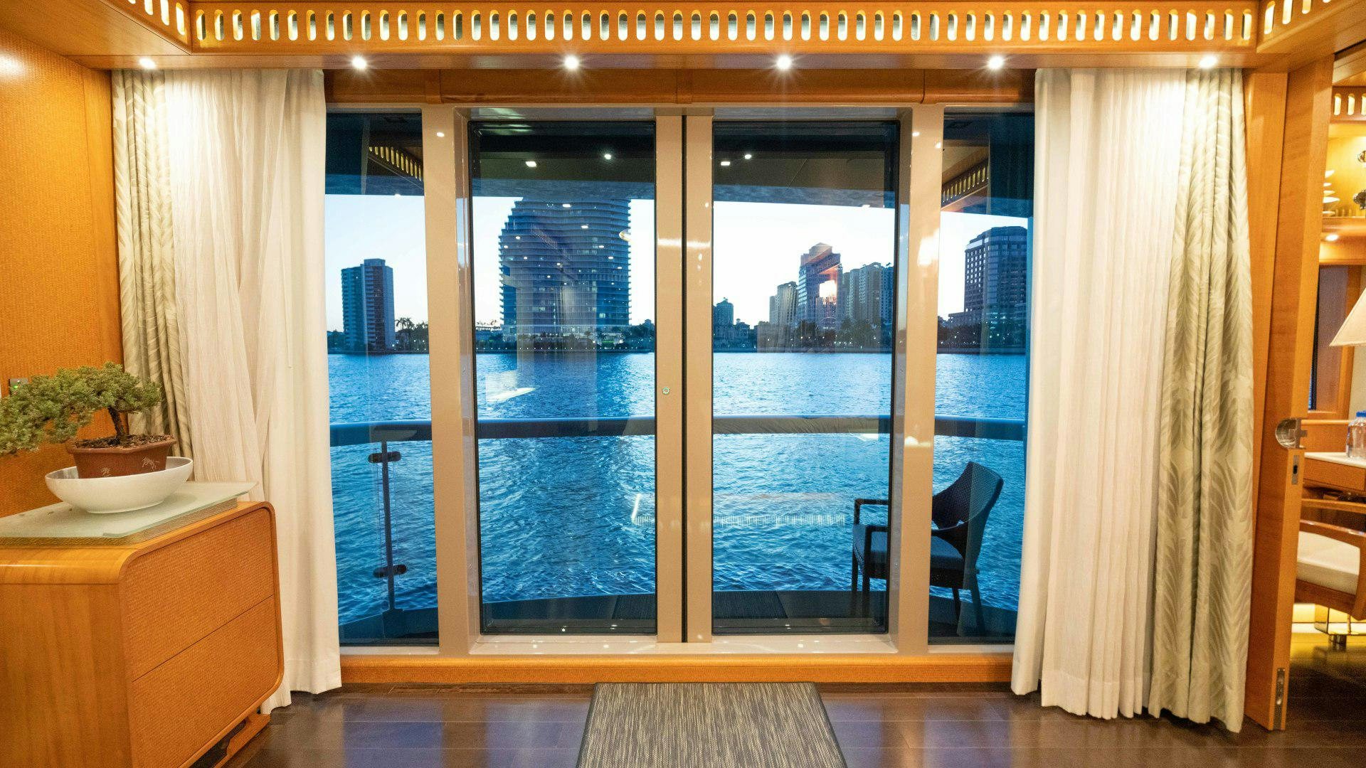 a room with a large glass door aboard SERENITY Yacht for Sale