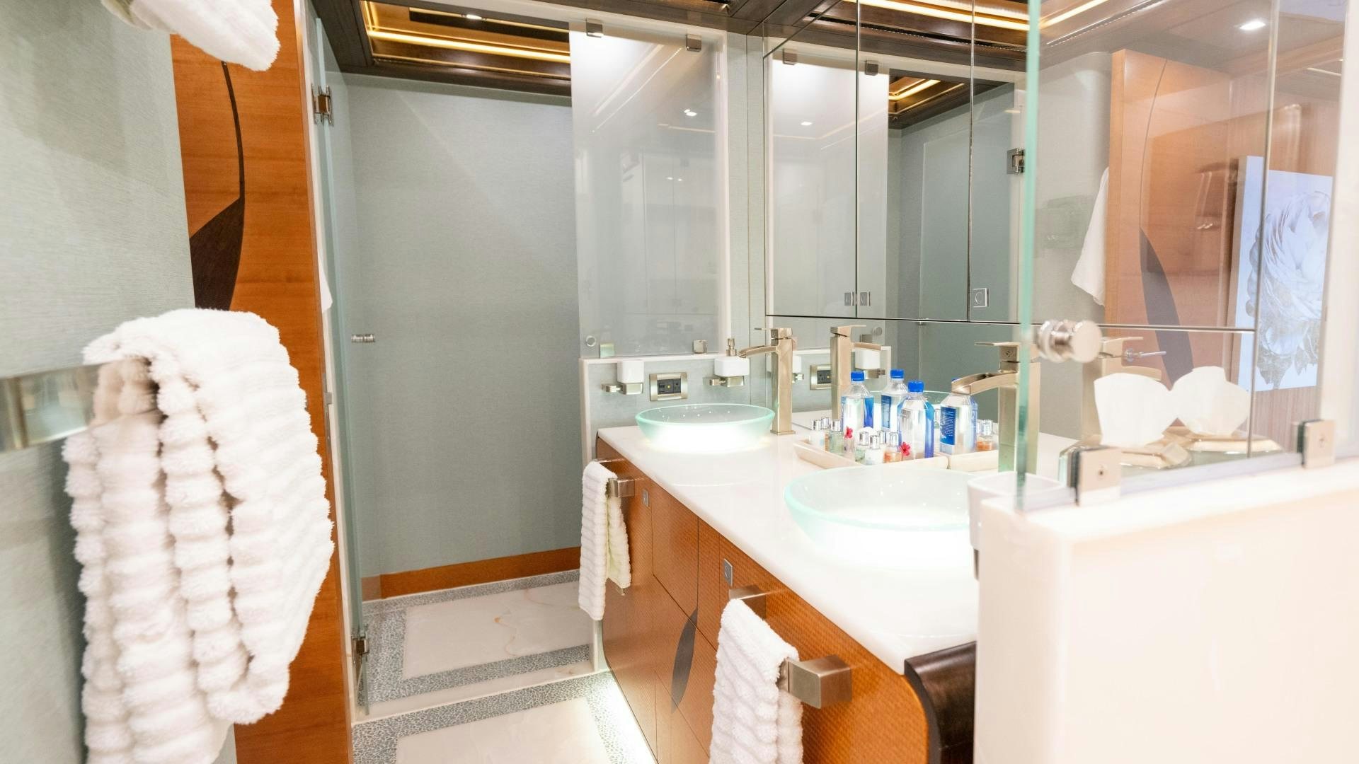 a bathroom with a large mirror aboard SERENITY Yacht for Sale