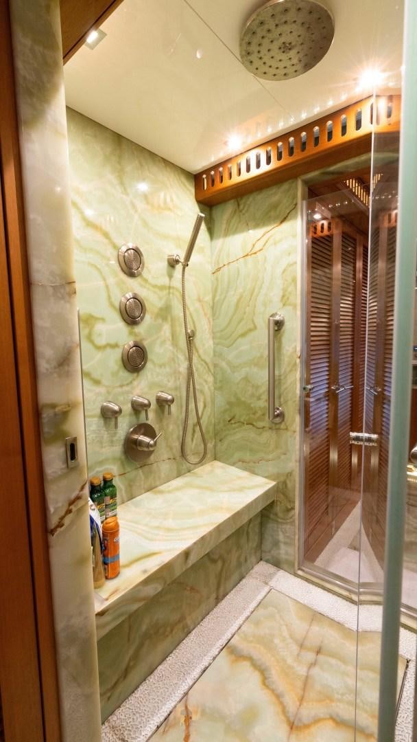 a bathroom with a shower and a sink aboard SERENITY Yacht for Sale