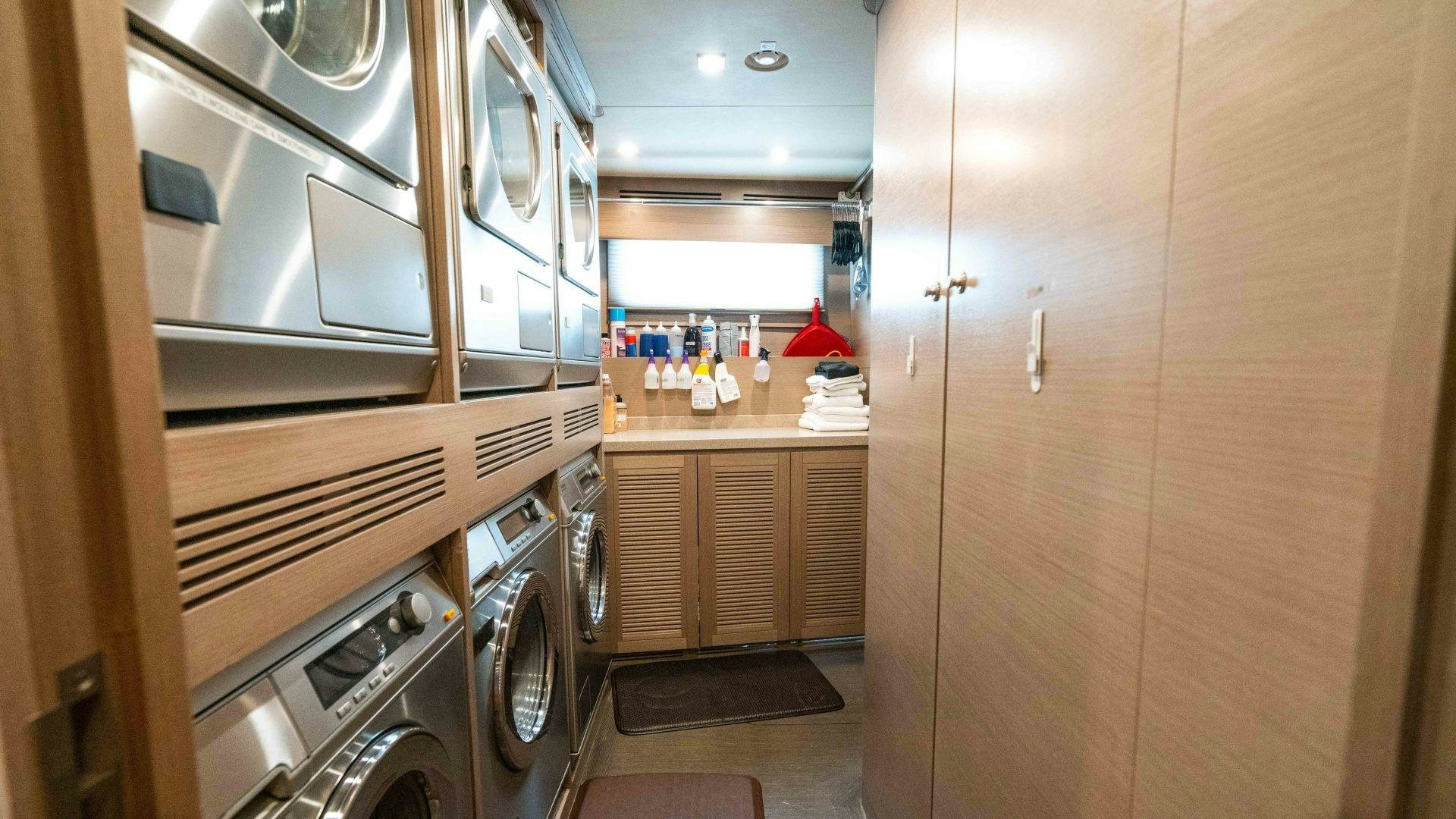 a kitchen with stainless steel appliances aboard SERENITY Yacht for Sale