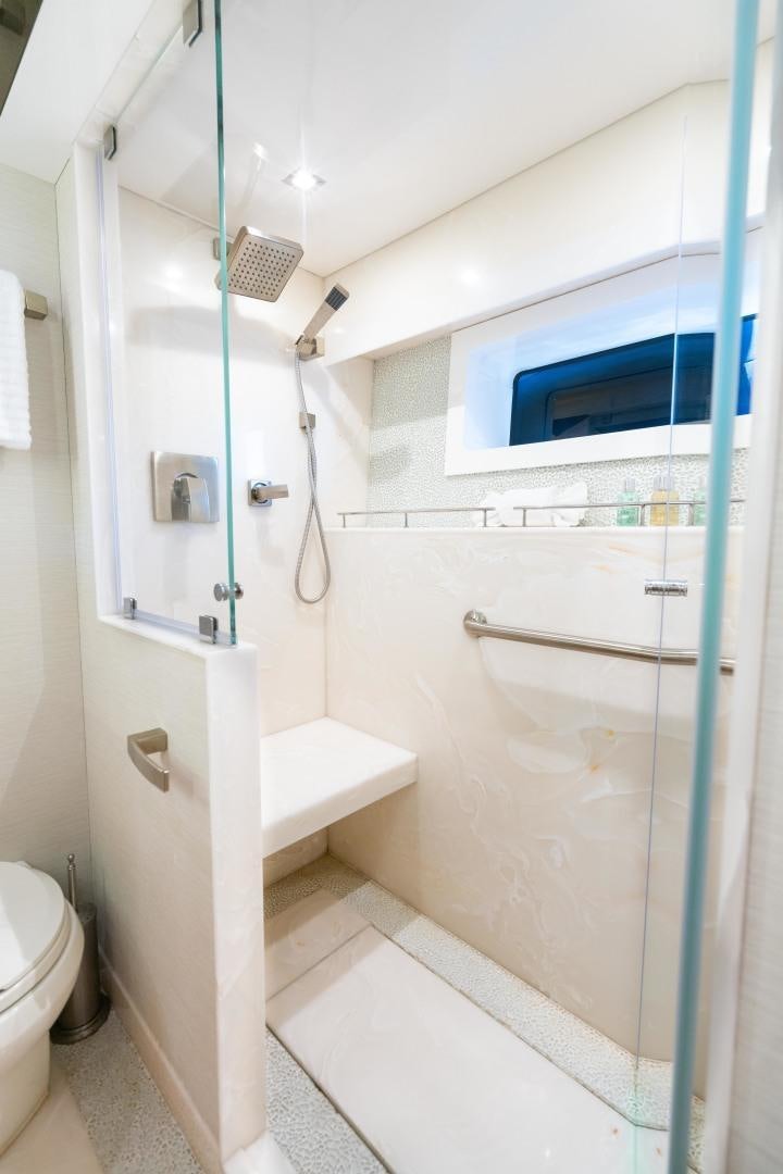 a bathroom with a shower unit aboard SERENITY Yacht for Sale