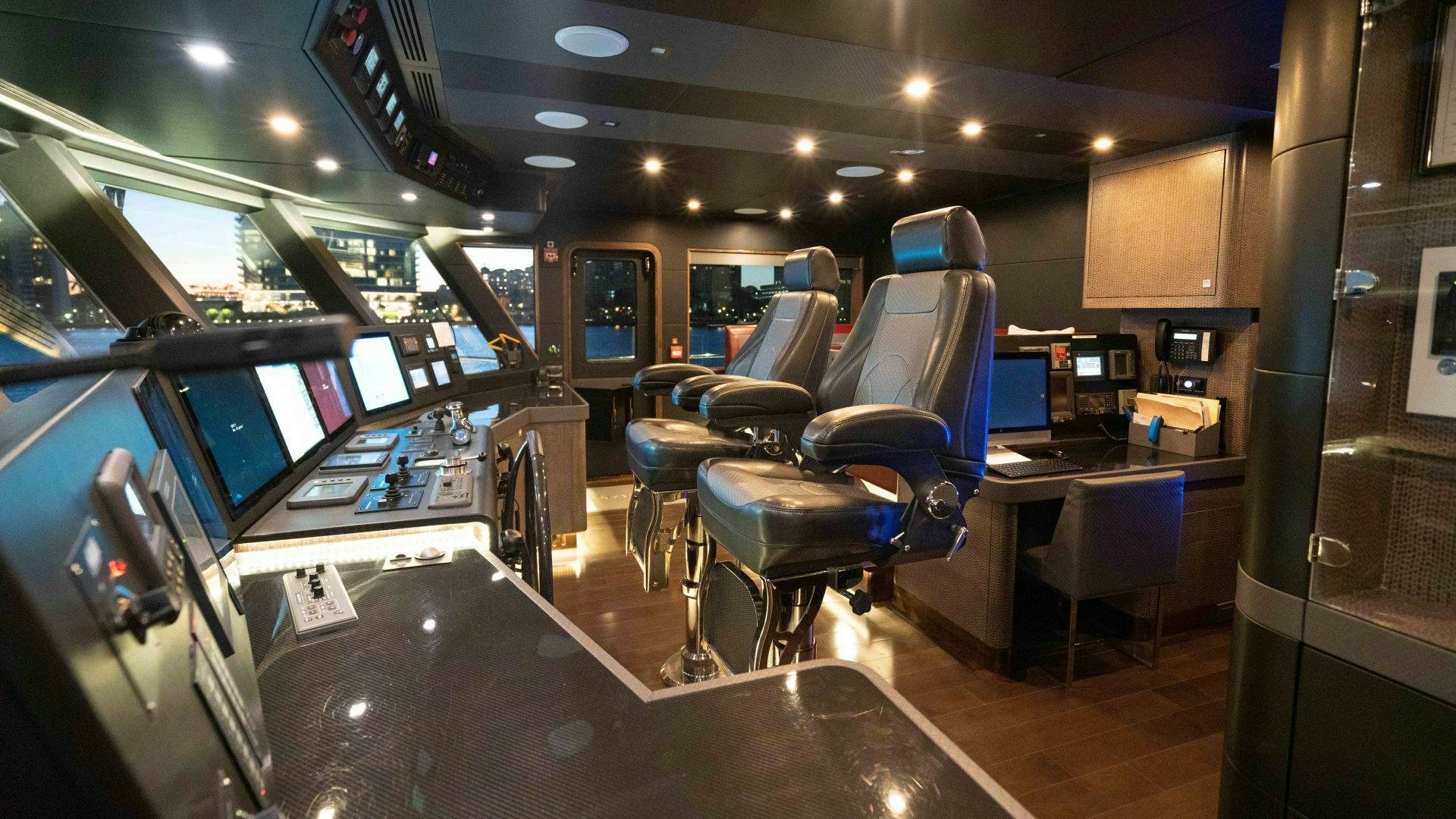 a room with a row of computers aboard SERENITY Yacht for Sale