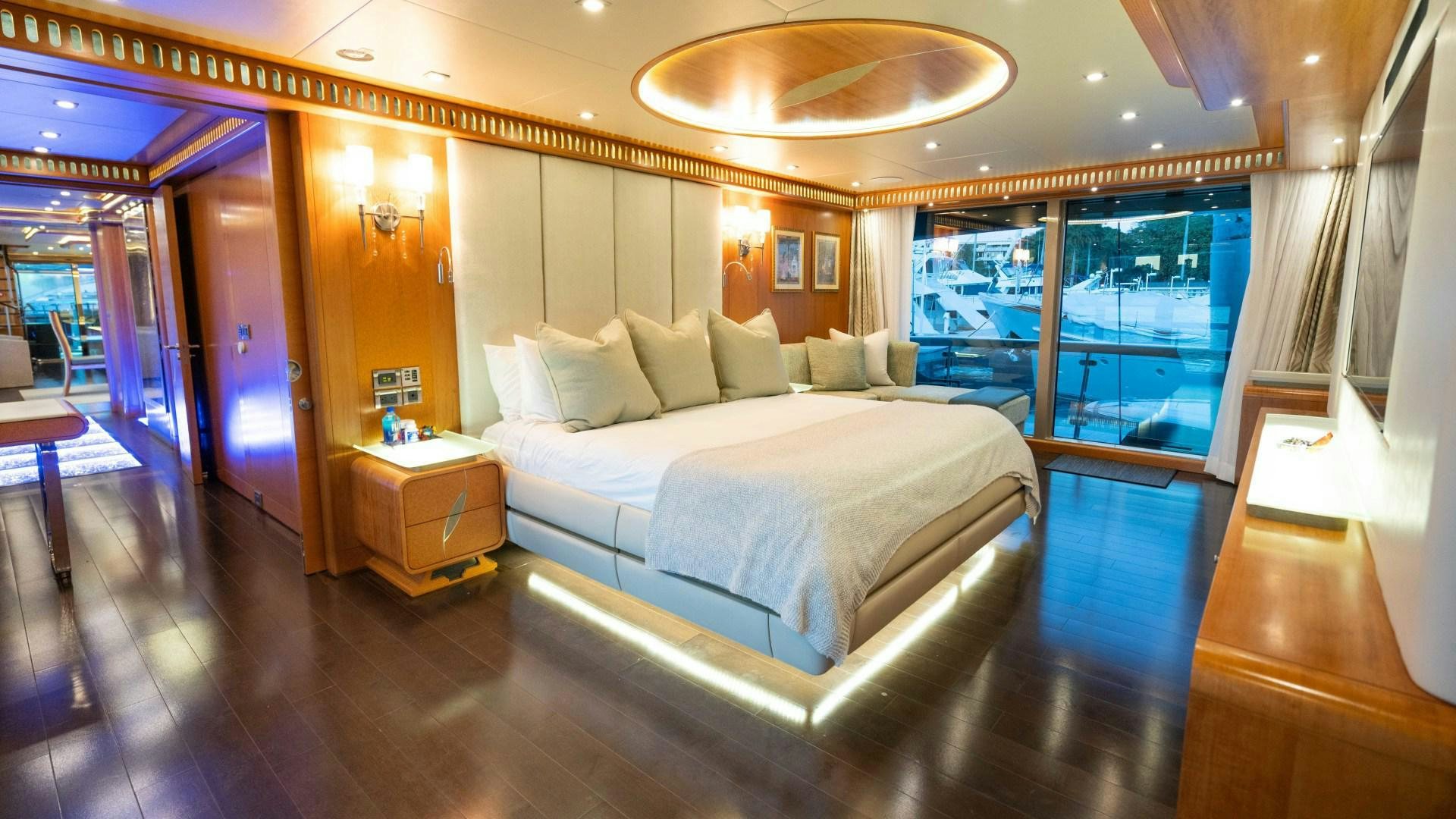 a large bed in a room aboard SERENITY Yacht for Sale