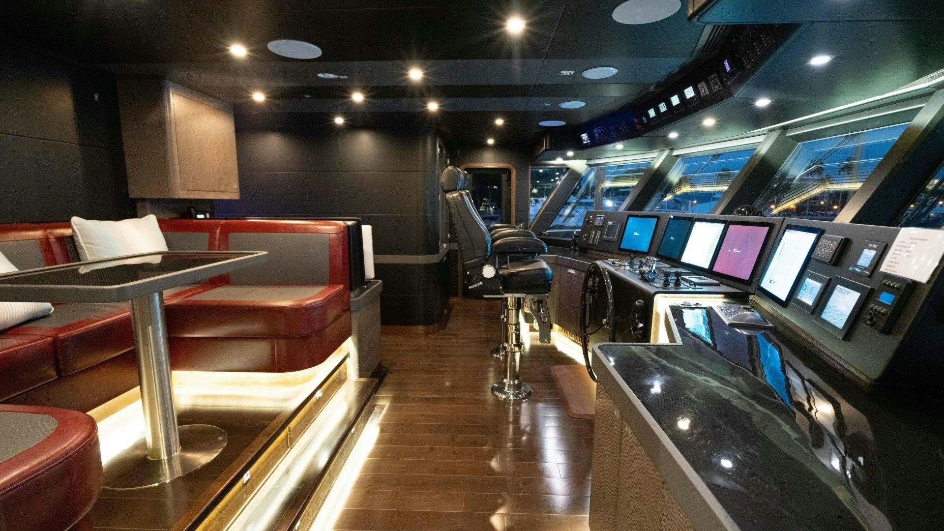 a room with a row of computers aboard SERENITY Yacht for Sale