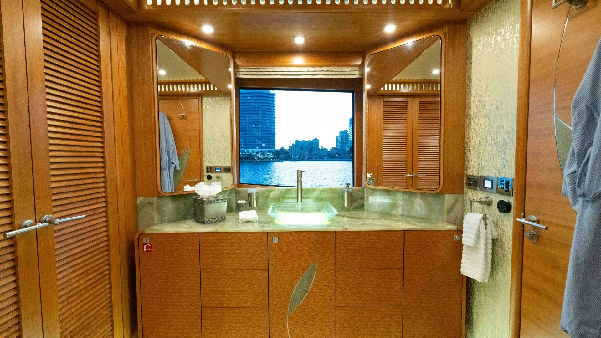 a bathroom with a sink and cabinets aboard SERENITY Yacht for Sale
