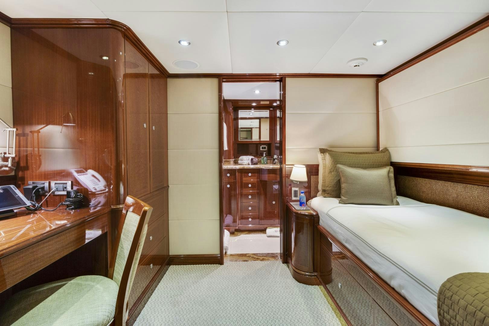 a room with a bed and a desk aboard SERQUE Yacht for Sale