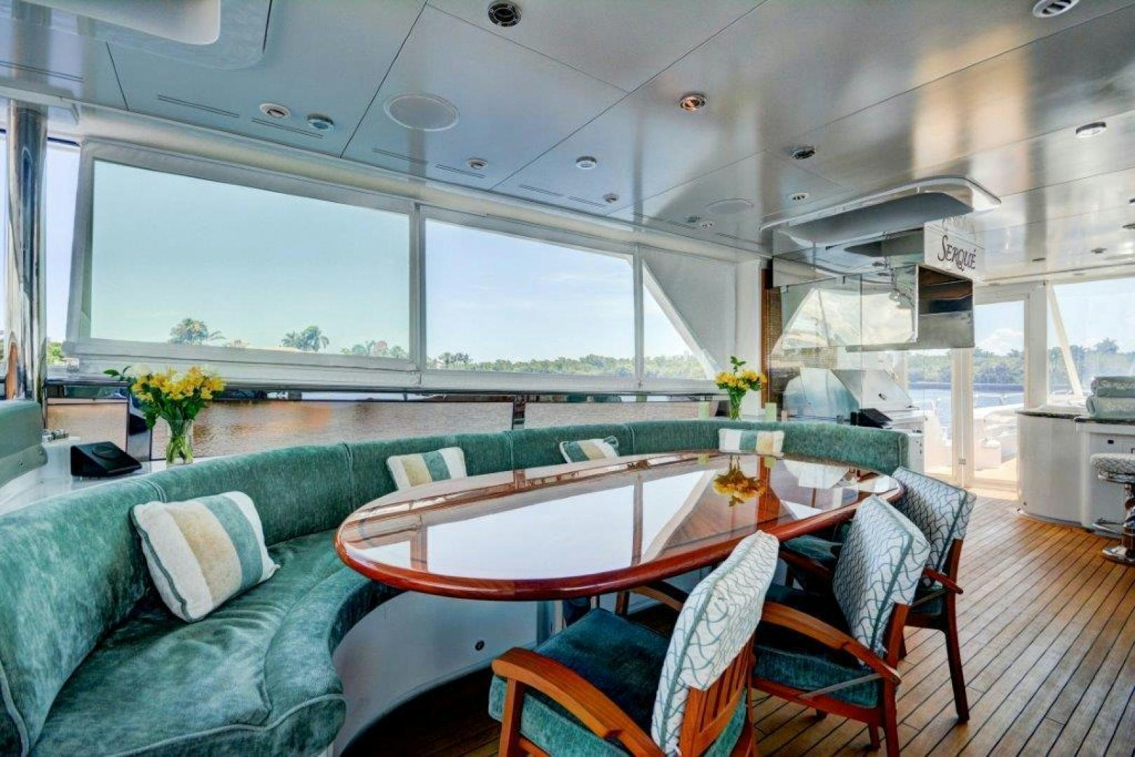 a living room with a couch and a table aboard SERQUE Yacht for Sale