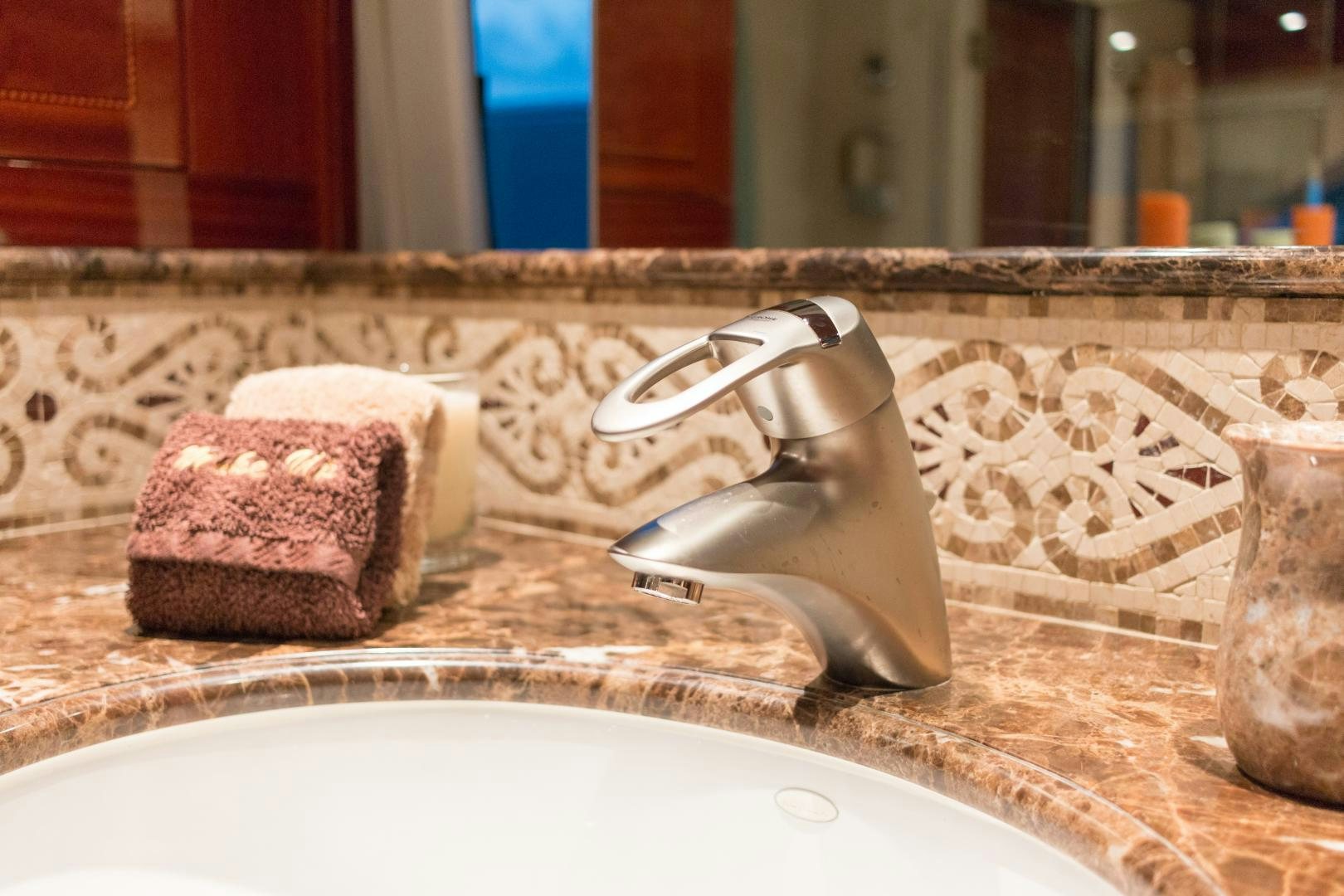 a sink with a faucet and a couple of soapy soaps on it aboard SERQUE Yacht for Sale