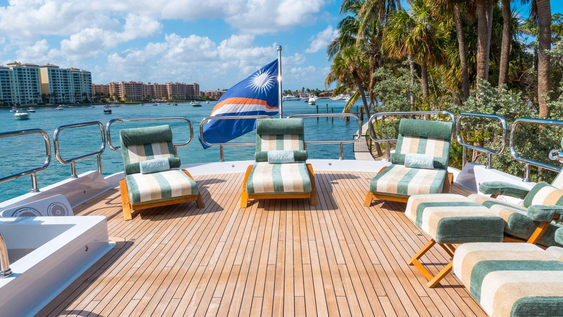 a deck with chairs and umbrellas aboard SERQUE Yacht for Sale