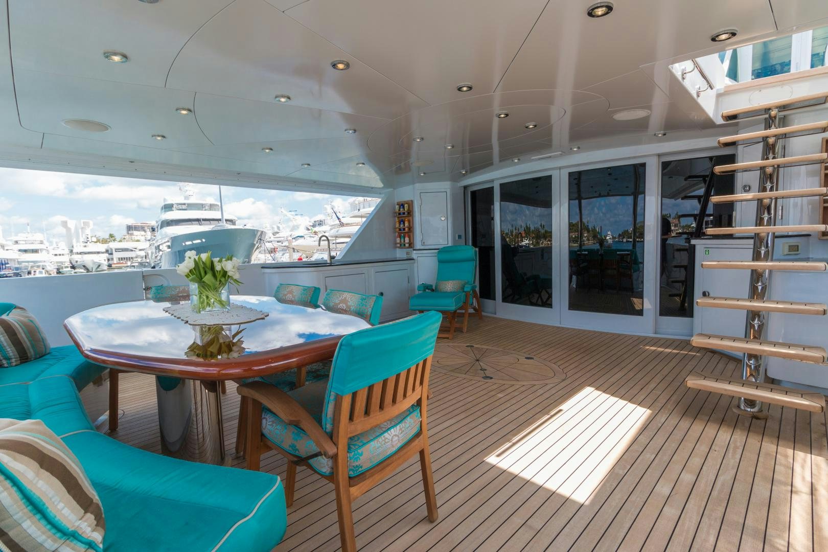 a room with a table and chairs aboard SERQUE Yacht for Sale