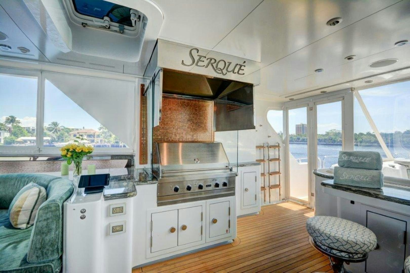 a kitchen with a stove and cabinets aboard SERQUE Yacht for Sale