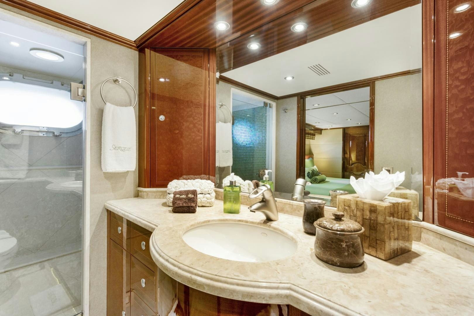 a bathroom with a large mirror aboard SERQUE Yacht for Sale