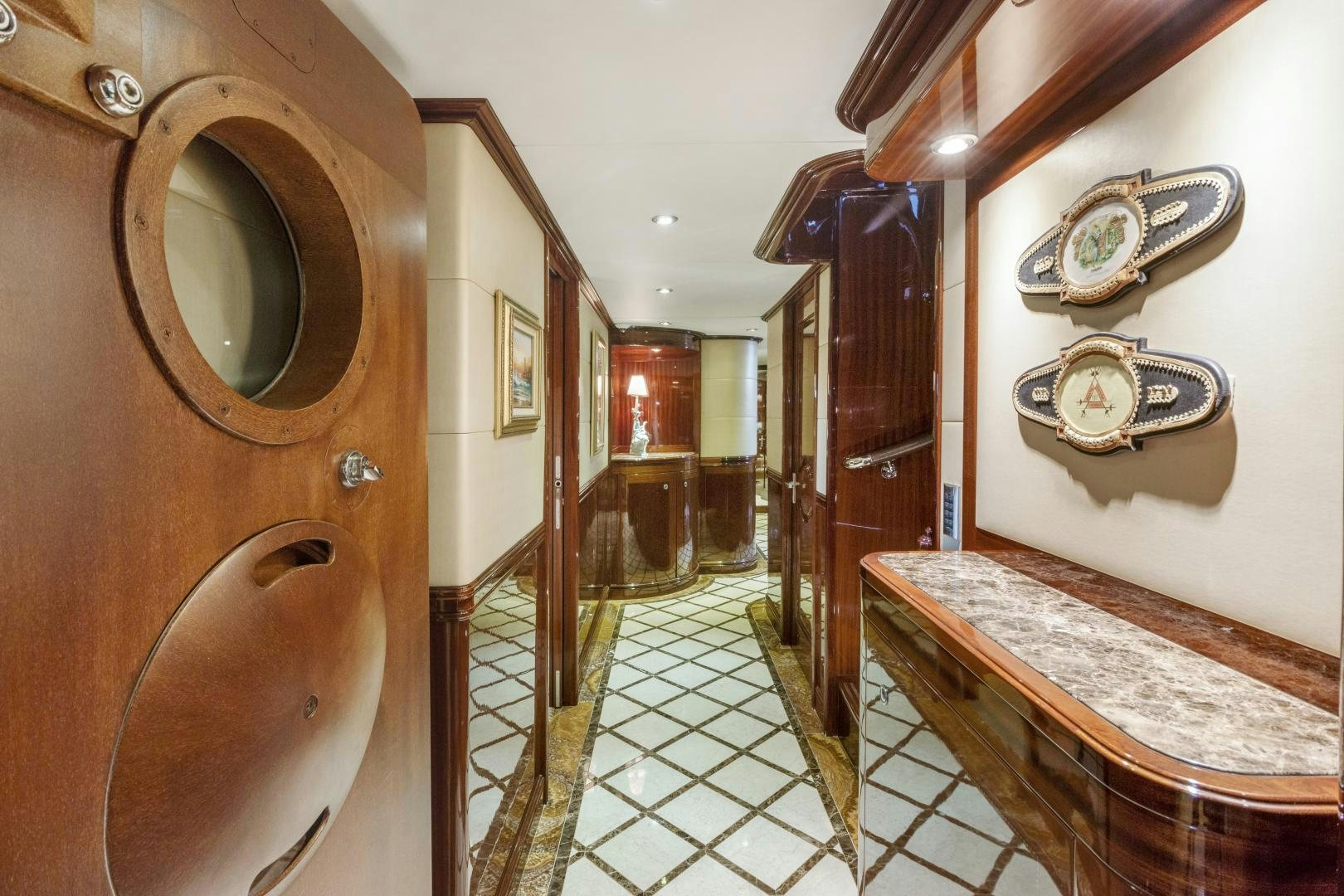 a hallway with wood doors aboard SERQUE Yacht for Sale