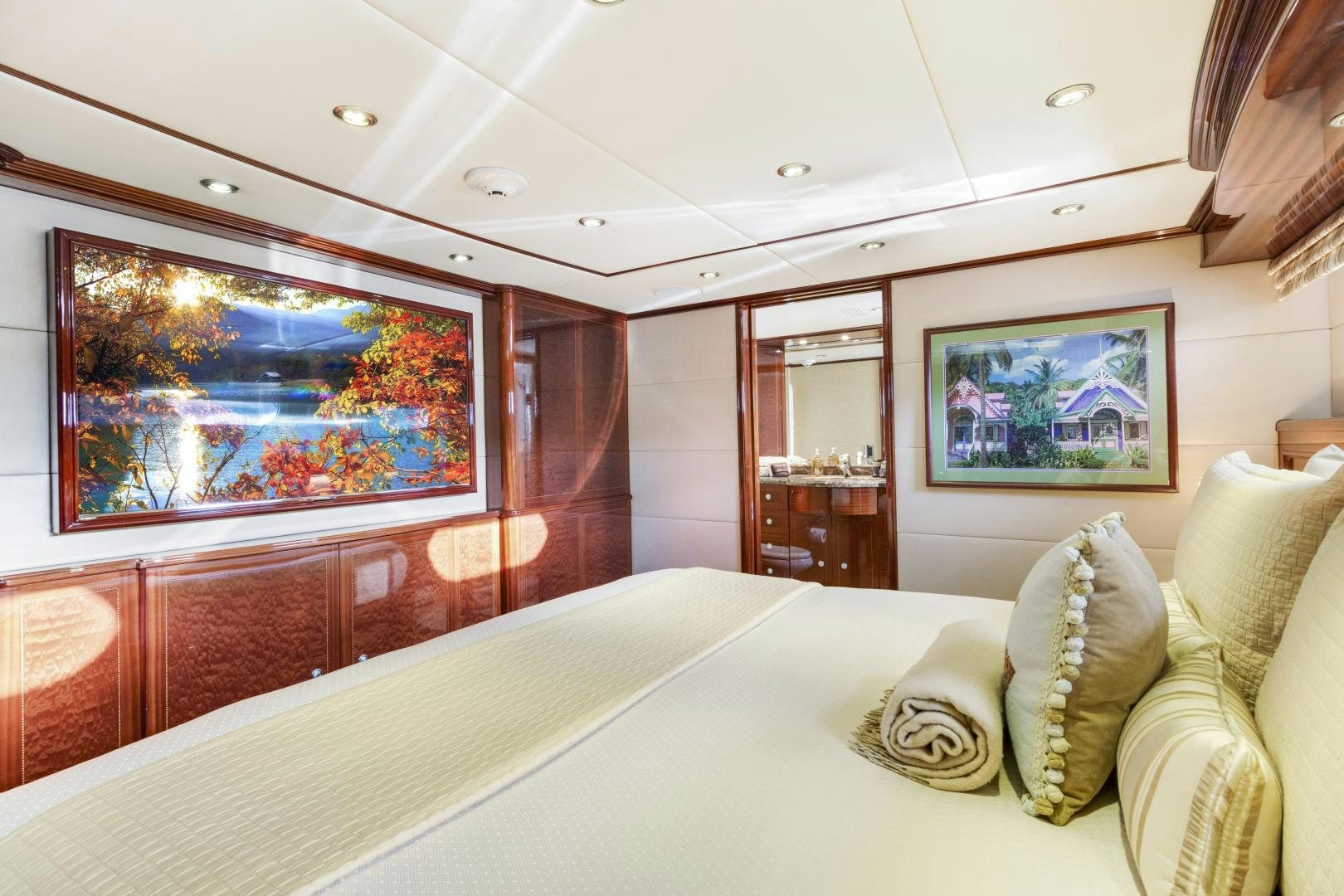 a large bedroom with a large mirror aboard SERQUE Yacht for Sale