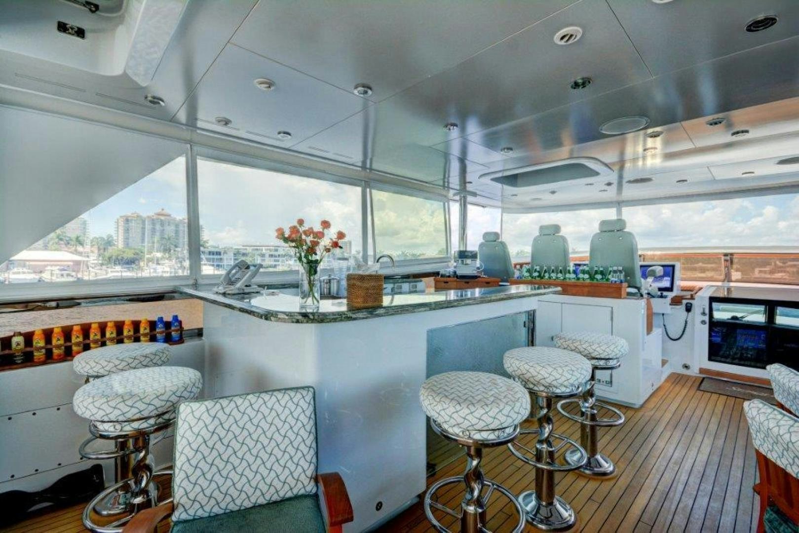 a kitchen with a table and chairs aboard SERQUE Yacht for Sale