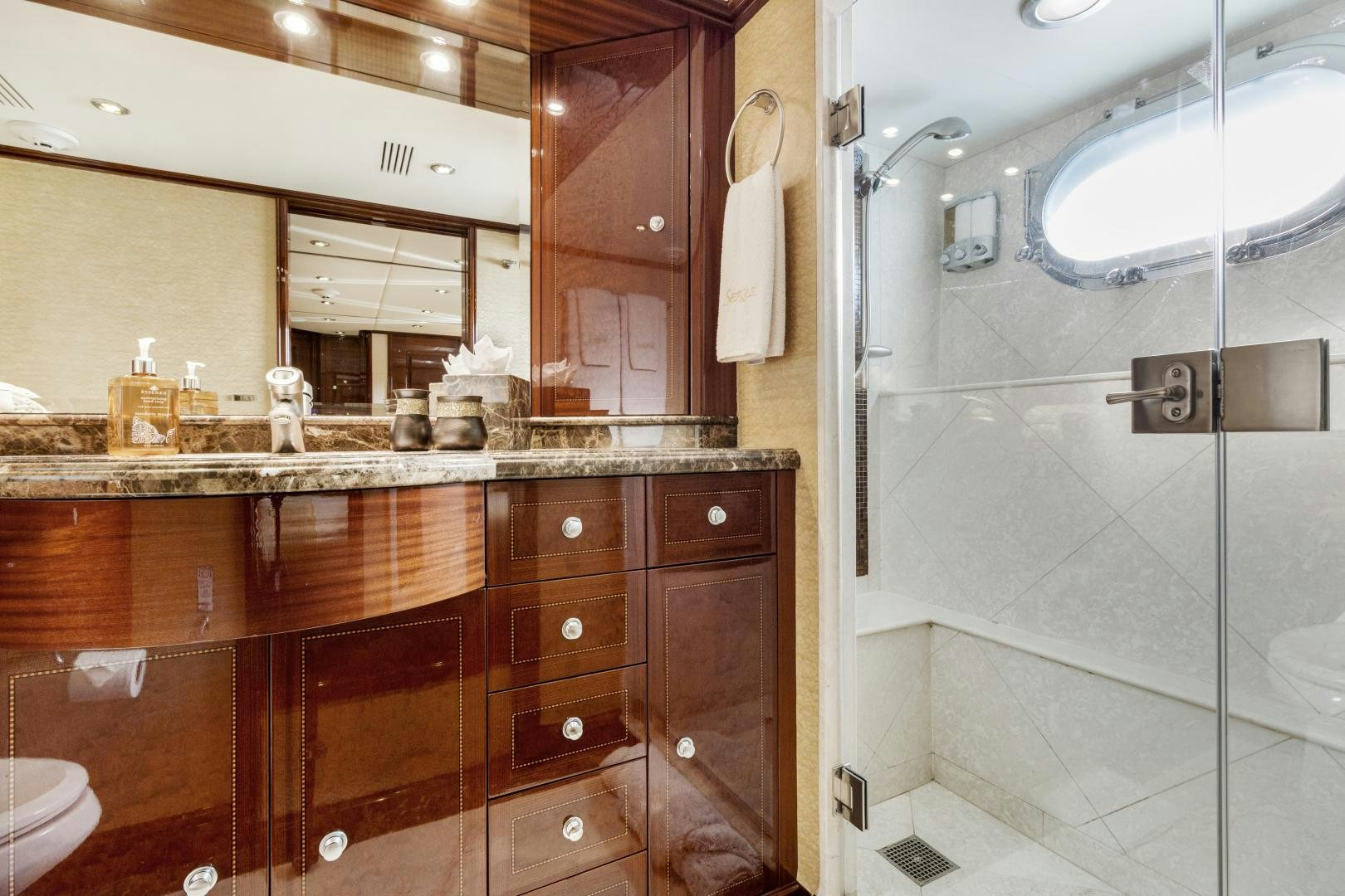 a bathroom with a glass shower aboard SERQUE Yacht for Sale