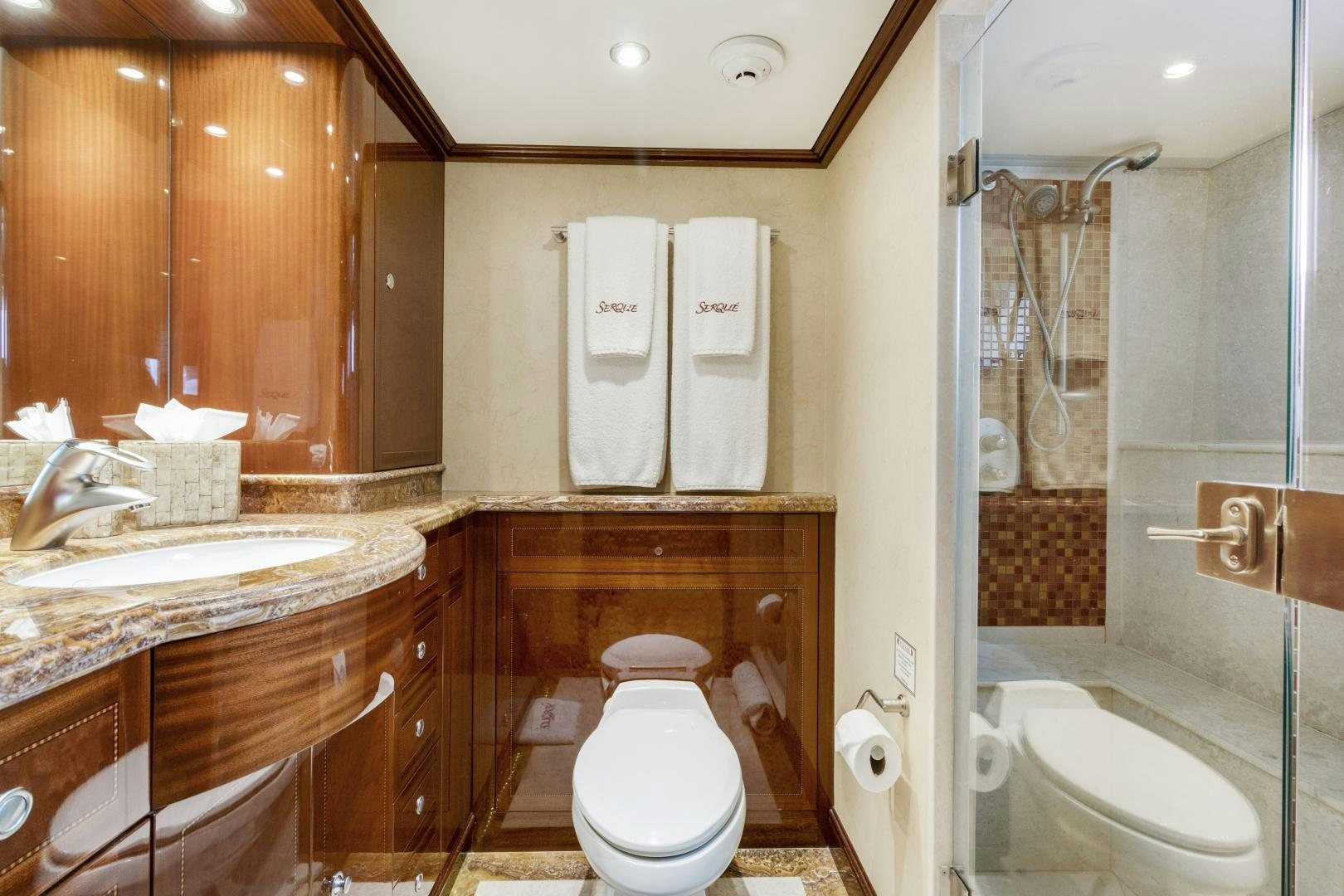 a bathroom with a toilet and sink aboard SERQUE Yacht for Sale