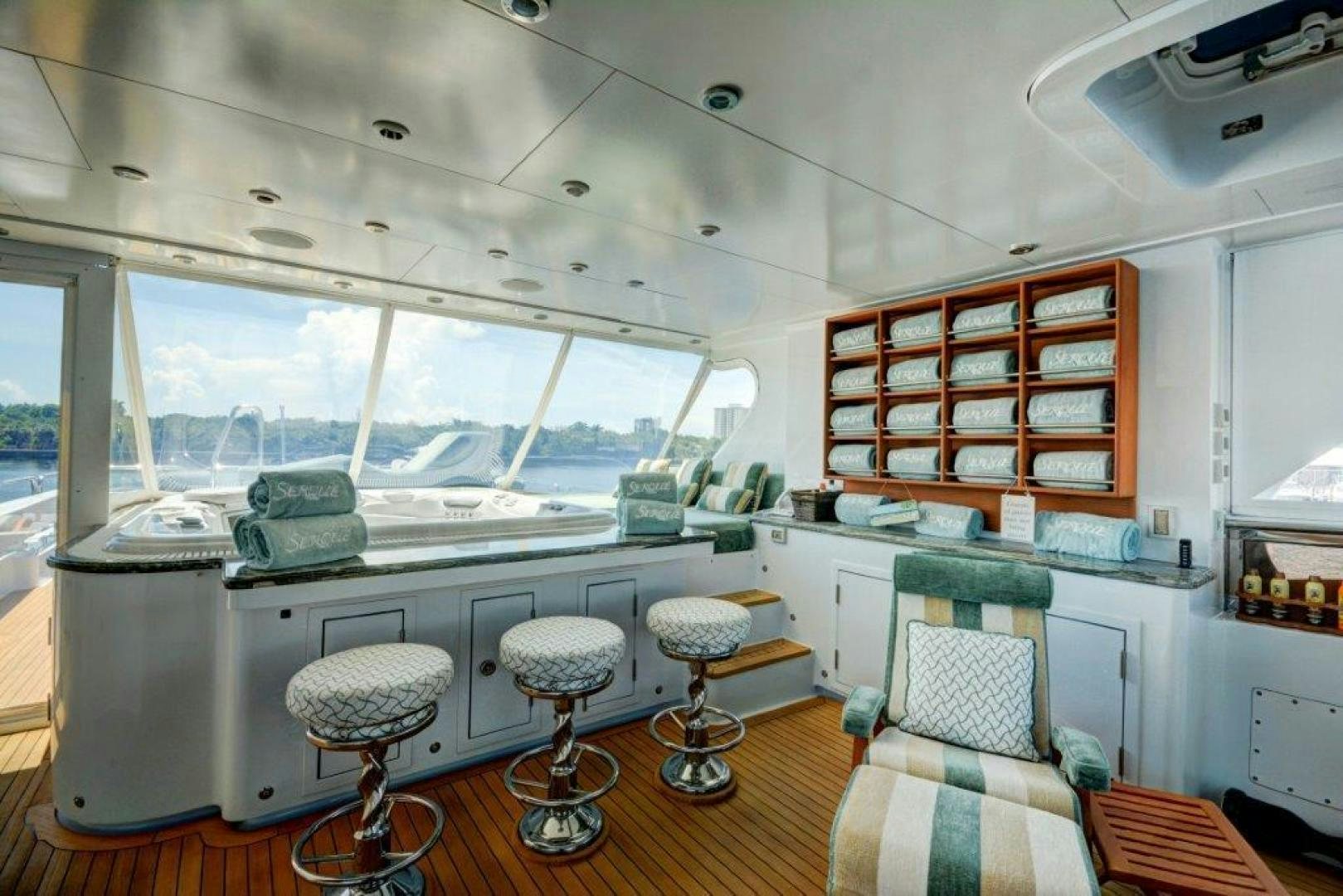 a room with a table and chairs aboard SERQUE Yacht for Sale