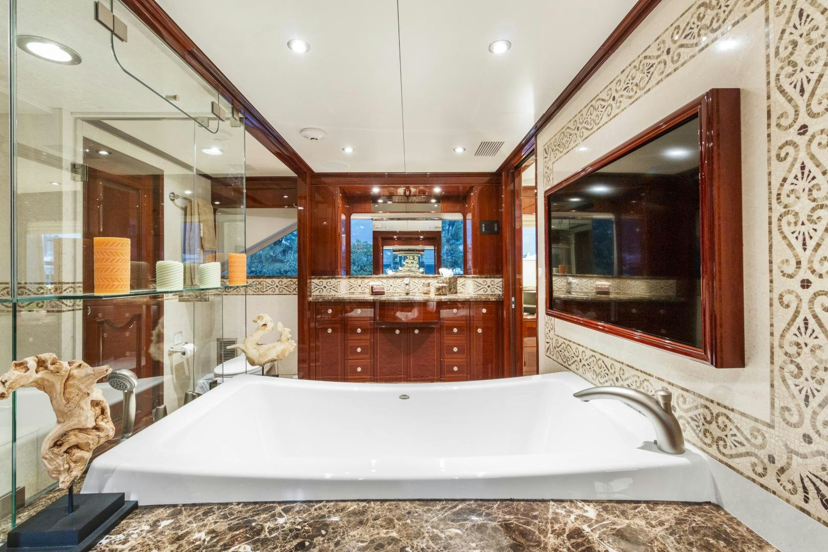 a bathroom with a large mirror aboard SERQUE Yacht for Sale