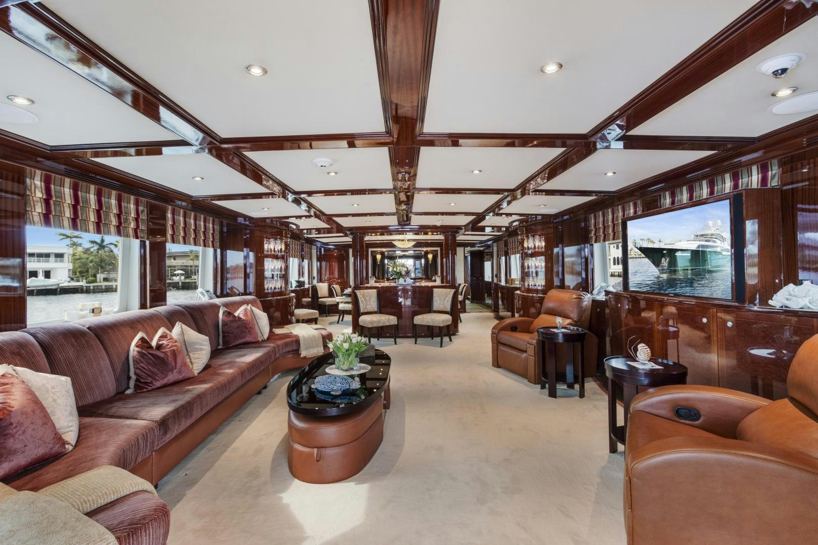 a living room with a large window aboard SERQUE Yacht for Sale