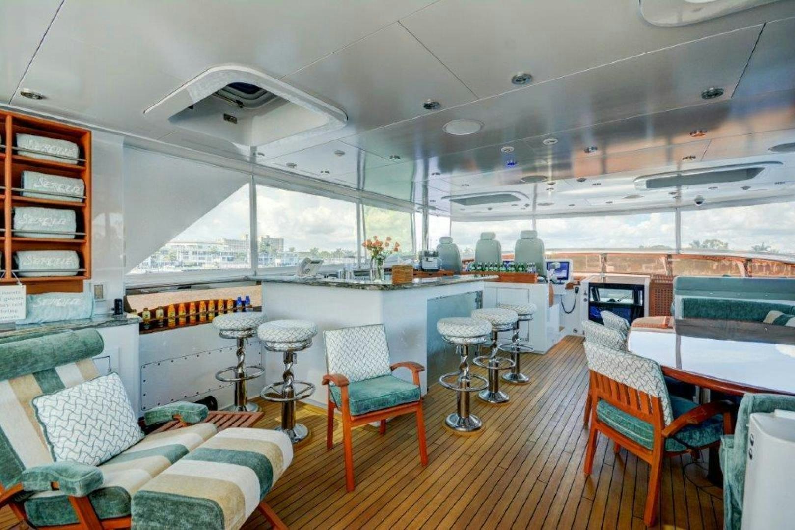 a room with a couch and chairs aboard SERQUE Yacht for Sale