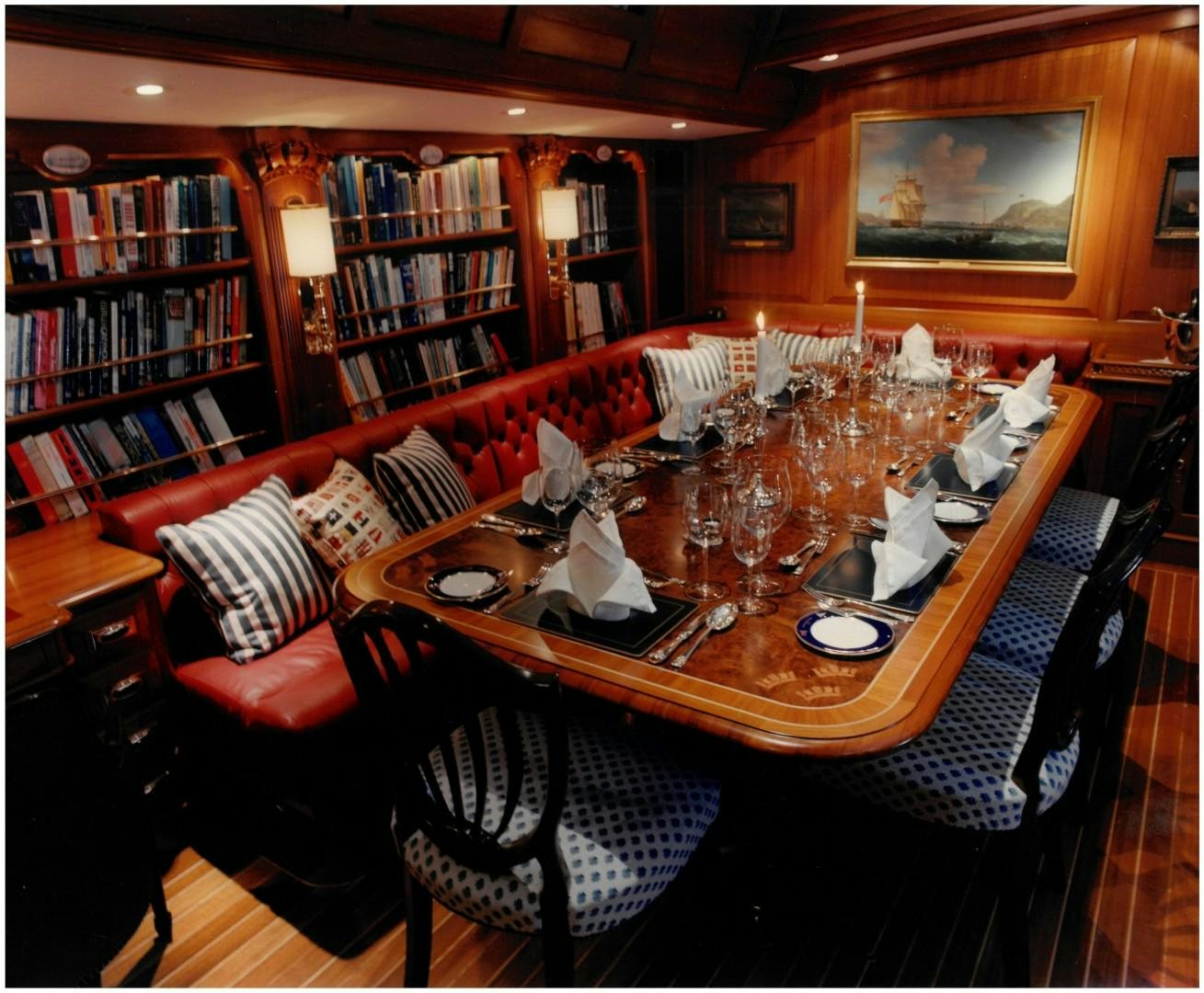 a dining table in a library aboard ANAKENA Yacht for Sale