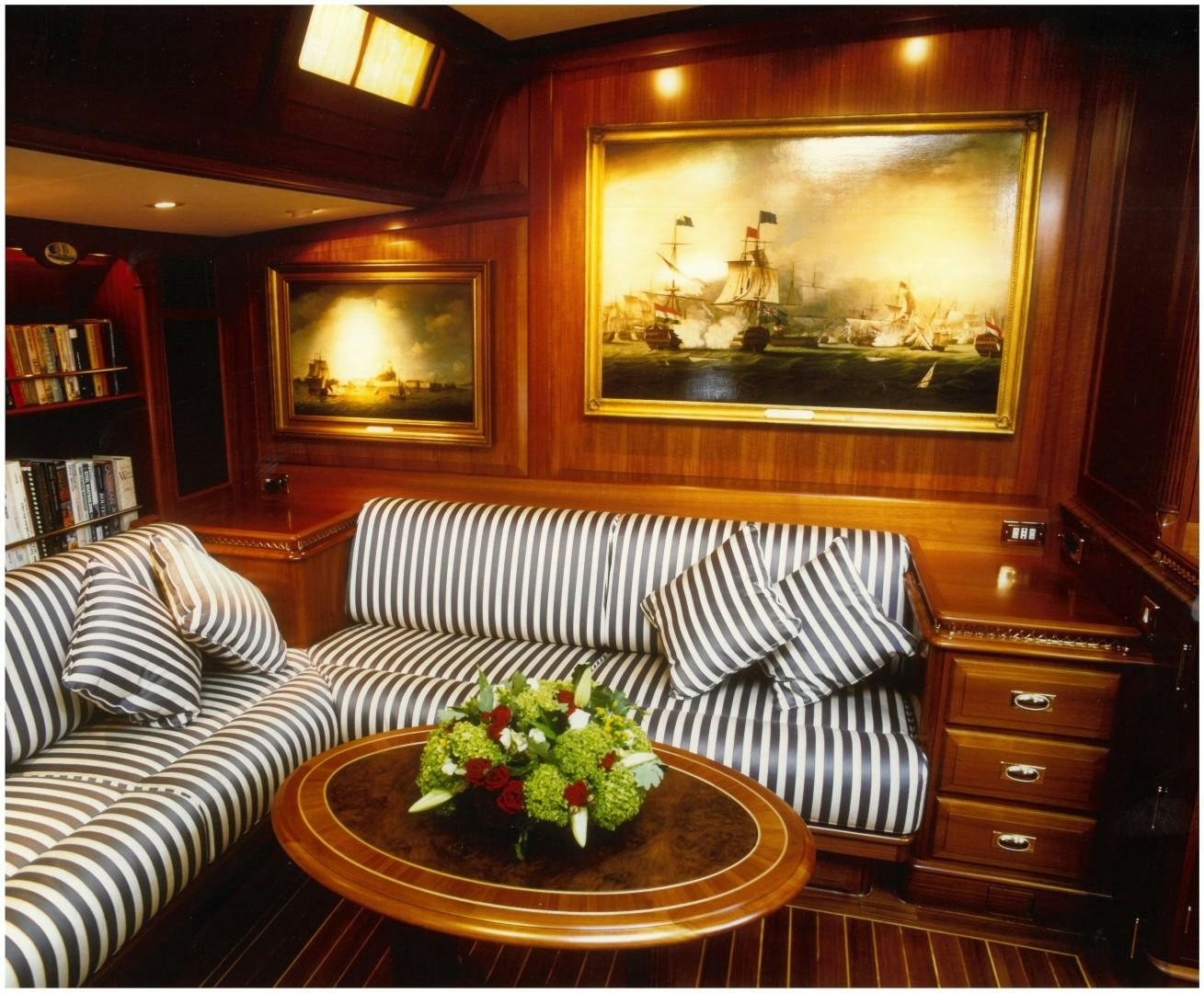 a living room with a couch and a table aboard ANAKENA Yacht for Sale