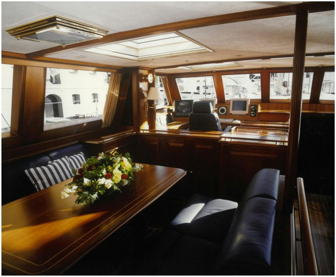 a room with a table and chairs aboard ANAKENA Yacht for Sale