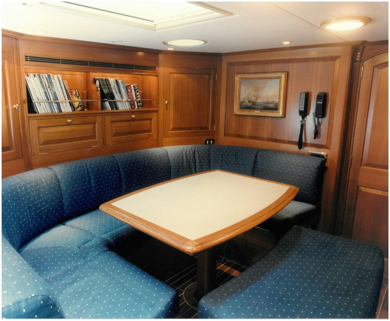 a living room with a couch and a coffee table aboard ANAKENA Yacht for Sale