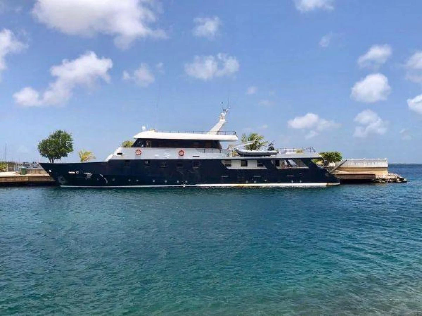 a large boat in the water aboard STAR ALLIANCE Yacht for Sale