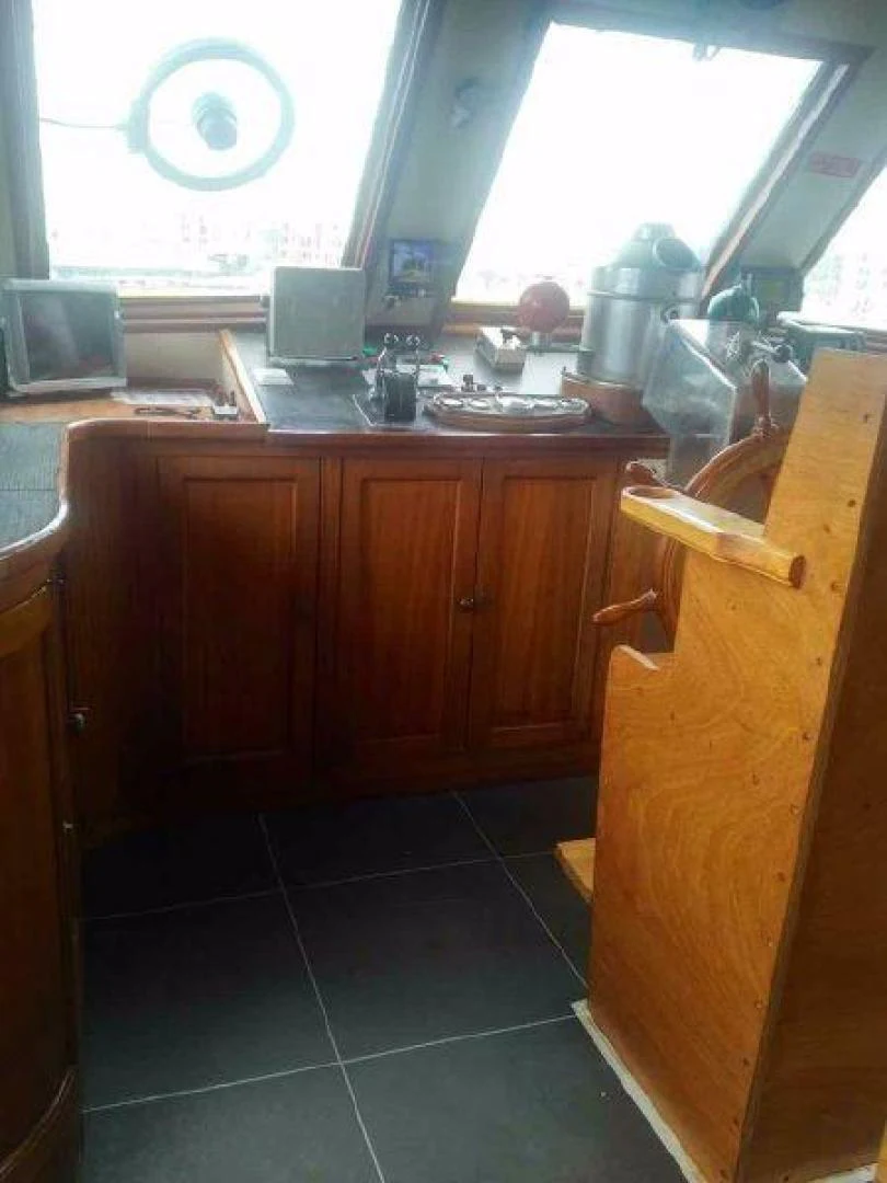 a kitchen with a computer and a window aboard STAR ALLIANCE Yacht for Sale