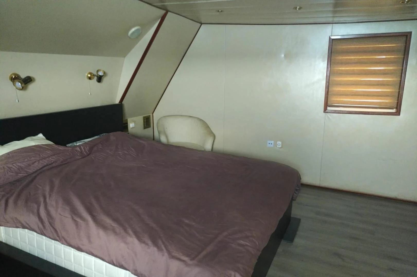 a bed with a pink comforter aboard STAR ALLIANCE Yacht for Sale