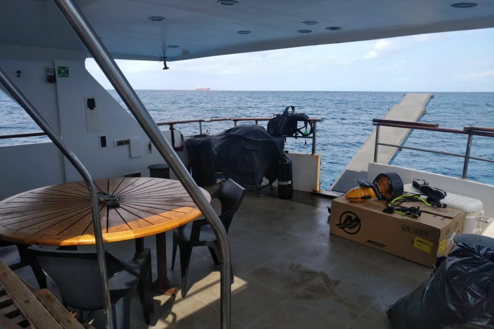 a boat with a table and chairs on the deck aboard STAR ALLIANCE Yacht for Sale