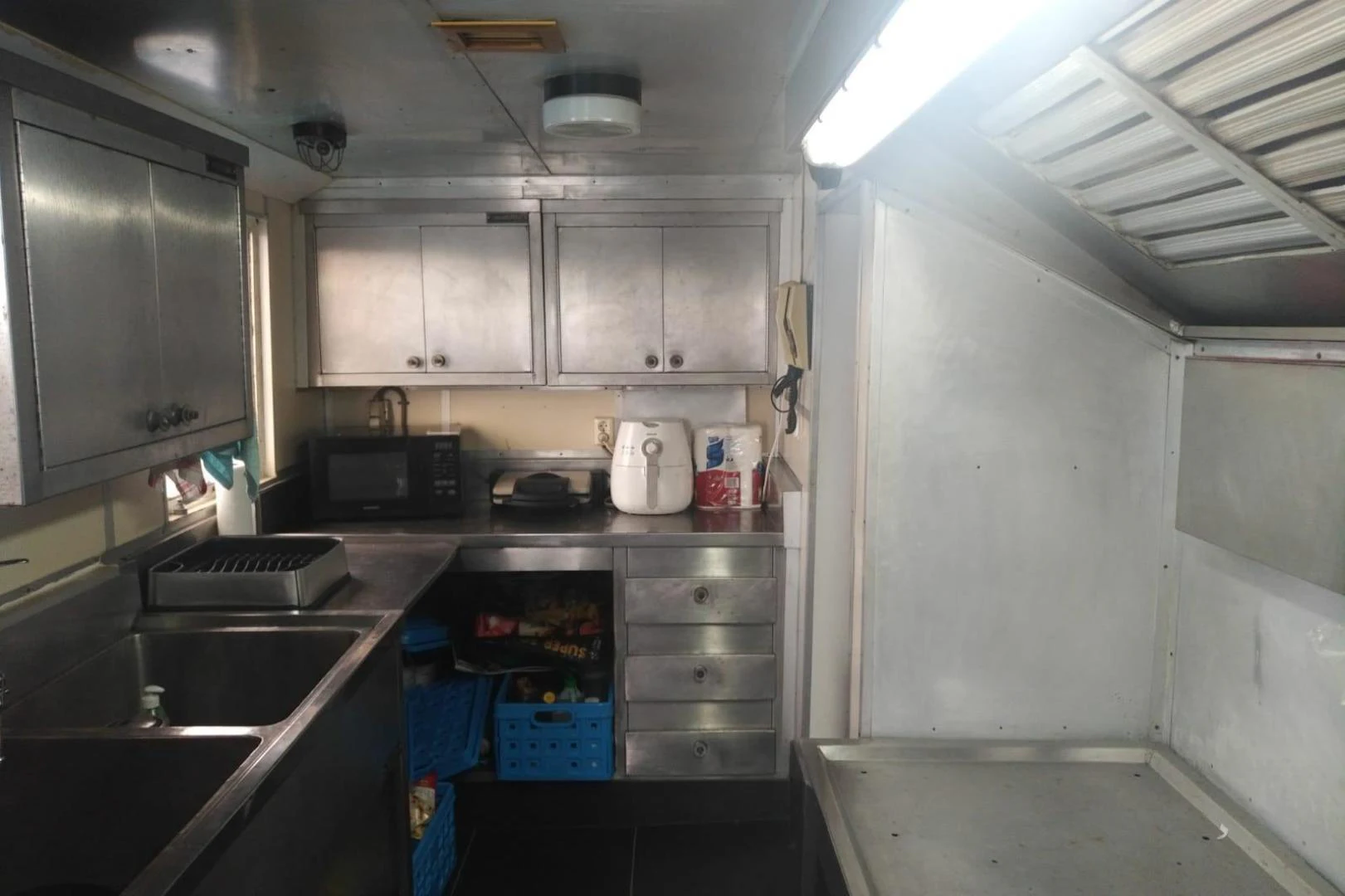 a kitchen with a sink and cabinets aboard STAR ALLIANCE Yacht for Sale